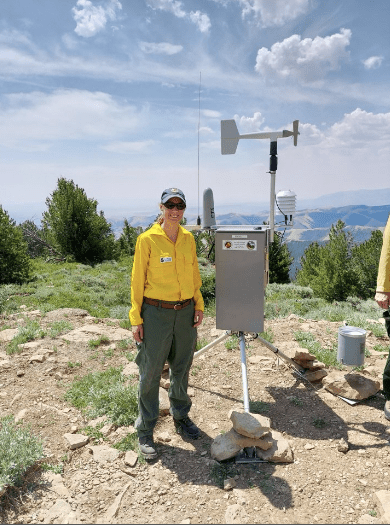 Julie Malingowski taking meteorological measurements in the field. (Photo courtesy of Julie Malingowski)